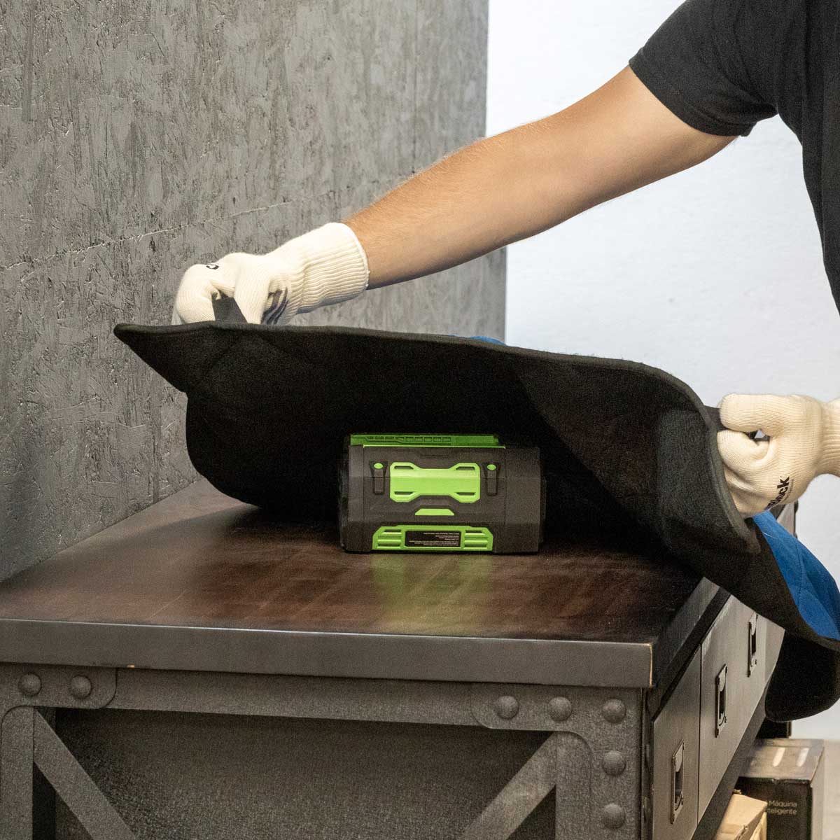 handle a risky battery with FireShield Blankets